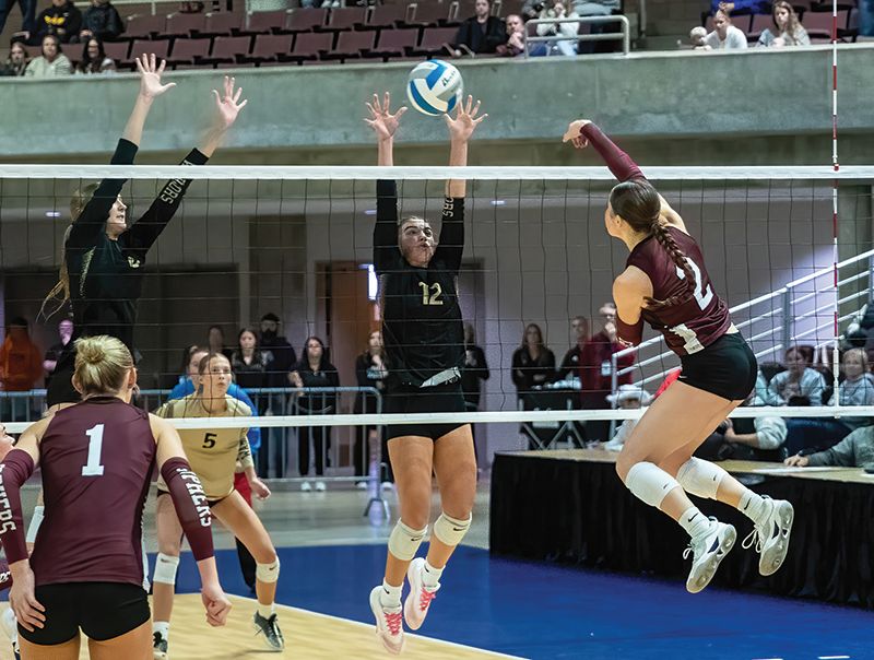 Chatfield’s Cora Bicknese gets a hard shot to deflect off a Caledonia defender (pictured are Kensey King and Ashlyn Reinhart) for the Section title-securing kill in the Gophers’ 3-1 win. Photo by Leif Erickson