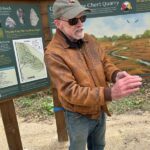 Archaeologist Tom Trow introduces the quarry to guests. Photo by Wanda Hanson