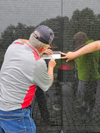 Phillip Goldsmith doing a rubbing for a close friend at the Vietnam Veterans Memorial. Photo submitted