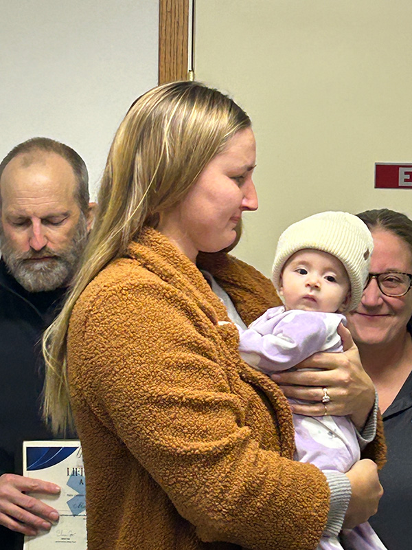 Mom Grace beams at her daughter Lilah Christiansen during the ambulance awards. In the background are Marty Momsen and Mimi Carlson. Photo by Wanda Hanson