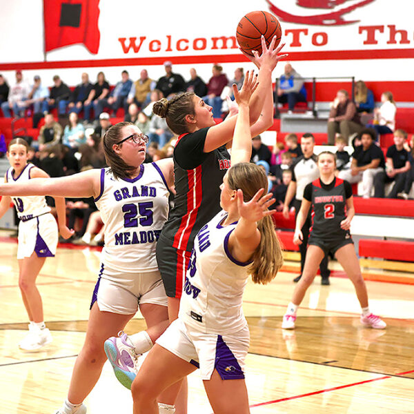 The girls basketball season got started including Grand Meadow playing at Houston. Above, Hurricane senior Jorja Meyer tries to score past Larks Cloey Breitbarth (#25) and Naomi Warmka (#23) in a Houston’s 68-42 win. Photo by Craig Johnson