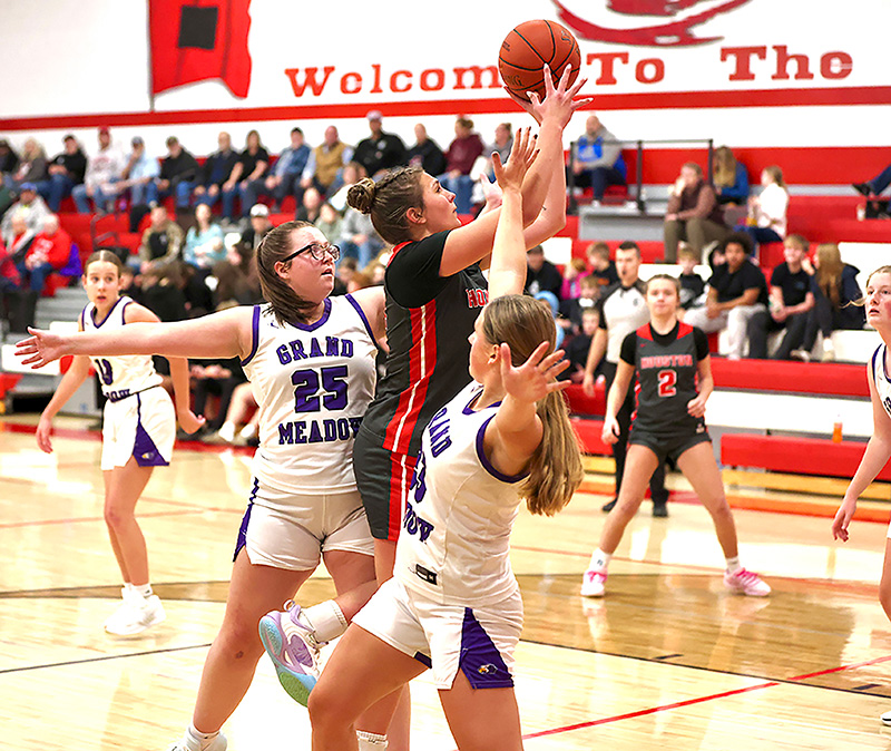 The girls basketball season got started including Grand Meadow playing at Houston. Above, Hurricane senior Jorja Meyer tries to score past Larks Cloey Breitbarth (#25) and Naomi Warmka (#23) in a Houston’s 68-42 win. Photo by Craig Johnson