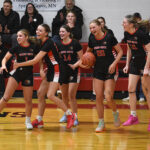 Spring Grove/Mabel-Canton girls (left to right) Siri Konkel, Kylie Hammel, Izabel Kaufmann, Kinley Soiney and Lauren Hammel celebrate an astonishing 61-60 comeback and last-second victory over previously undefeated Southland. The Lions (5-1, 7-2) took a half game lead over the Rebels (4-1, 5-1) and Lanesboro (4-1, 5-3) atop the SEC standings. Photo by Lee Epps