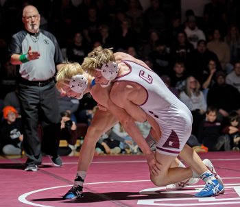 Chatfield’s Layne Root looks to trip down Kasson-Mantorville’s Kalin Anderson at 139-pounds. Root won the match by 6-4 decision, but in a battle of #2 in Class A versus #2 in Class AA (as of December 4), Chatfield fell to Kasson-Mantorville 29-26. Photo by Leif Erickson