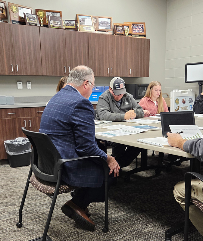 Jason Boynton delivers the audit report to the Fillmore Central board. Photo by Hannah Wingert