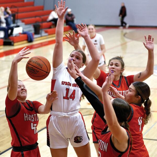Spring Grove/Mabel-Canton’s Izabel Kaufmann is surrounded by Houston players including Rylee Boldt (left #43), Jorja Meyer (back right), and Bella Rodriguez (#4). In a key SEC girls basketball contest, SG/M-C notched a commanding 56-29 win. Photo by Craig Johnson