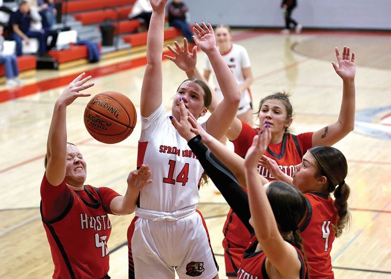 Spring Grove/Mabel-Canton’s Izabel Kaufmann is surrounded by Houston players including Rylee Boldt (left #43), Jorja Meyer (back right), and Bella Rodriguez (#4). In a key SEC girls basketball contest, SG/M-C notched a commanding 56-29 win. Photo by Craig Johnson