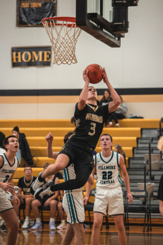 Caledonia’s Grant King contorts for a lay up in the Warriors 108-63 TRC win over Fillmore Central where the sophomore guard went for 26 (pts), 11 (asts), and 7 (stls). Photo by Isaac Blocker