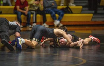 Jace Conway ties to squeeze for the pin (he would get) in a 114-pound match between Caledonia/Houston and D-II fifth ranked Galesville-Ettrick-Trempealeau/Melrose-Mindoro. The Wisconsin school posted a 44-22 win. Photo by Emma Geiwitz