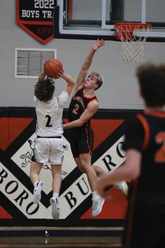 Lanesboro’s Mason Gilbertson gets back on defense to contest the shot of Kingsland’s Max Snikter. The Burros notched wins over Kingsland 70-28 and Chatfield 77-67 on the week while falling to defending SEC-West champ Southland 82-35. Photo by Christine Vreeman