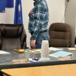 Caledonia Mayor Jeremy Leis leads his fellow council members and the audience in the Pledge of Allegiance at the November 24, 2025, council meeting. Photo by Charlene Corson Selbee