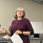 Kristin Prososki of TAB explained the voting process for the evening. Photo by Wanda Hanson