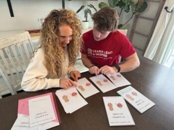 Nicole and Mason checking illustrations for their book. Photo submitted