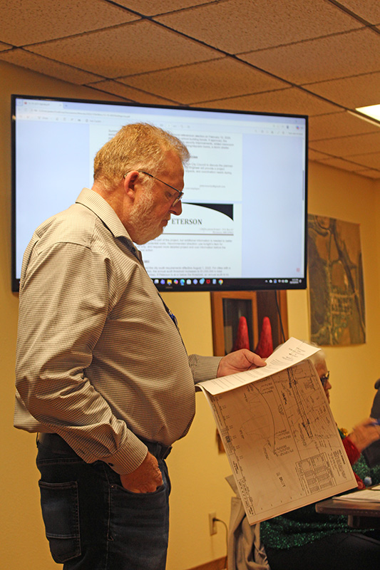 Fillmore County Engineer Ron Gregg addresses the Peterson Council at the December 10 meeting. Photo by Kirsten Zoellner