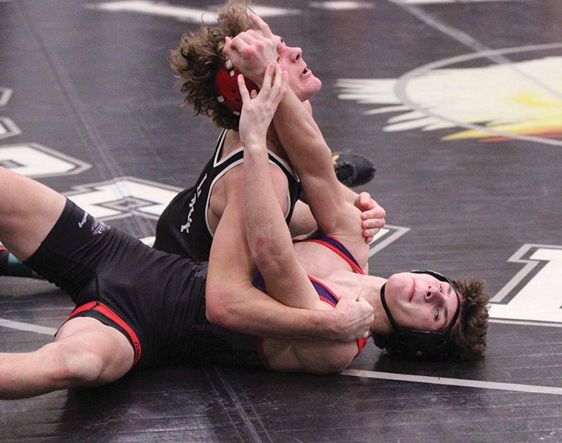 LARP’s Carter Bronk and GMLOS’ Cael Smith get physical in a 145-pound match at the Screamin’ Eagles’ quadrangular. Bronk won by 18-14 decision and LARP swept the quad plus a home triangular (including topping #3 K-W). All told, they went 7-1 on the week to improve to 5-1 in the TRC, 16-3 overall. Photo by Paul Trende