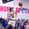 Rushford-Peterson senior Landon Dahl goes baseline for a reverse layup versus #9 in Class A Southland in the Trojans’ 80-71 win. Dahl scored 9 of his 11 points in the second half to help R-P hand the Rebels (5-1) their first loss. Photo by Paul Trende