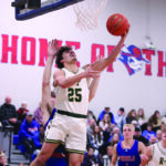 Rushford-Peterson senior Landon Dahl goes baseline for a reverse layup versus #9 in Class A Southland in the Trojans’ 80-71 win. Dahl scored 9 of his 11 points in the second half to help R-P hand the Rebels (5-1) their first loss. Photo by Paul Trende