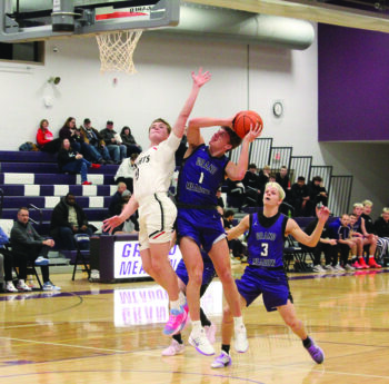 Grand Meadow’s Carter Glynn attempts the contested lay-up versus an Alden-Conger defender at the Larks home holiday tourney. GM beat the Knights 79-59 while falling to unbeaten Blooming Prairie 83-74. The Larks are 5-3 on the year and Glynn scored 62 points over the two contests including 39 versus BP. Photo submitted