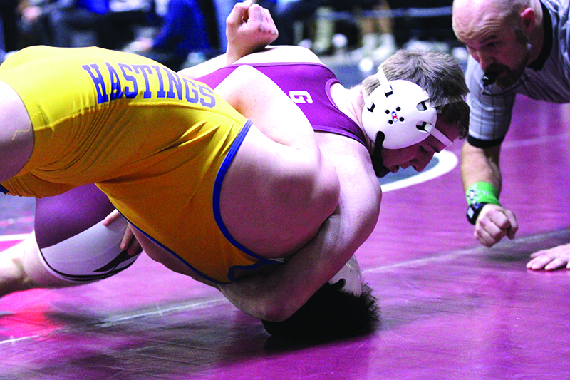 Chatfield’s Hunter Polikowsky has Hastings’ Rocco Iallonardo in deep trouble in a Bi-State consolation quarterfinal. Polikowsky won the match by 21-2 tech fall, went 6-2 for the tourney, and took fourth place overall of 60 at the 144-pound weight class. Photo by Paul Trende