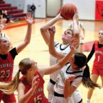 Caledonia’s Jessica Stendel battles inside against Lewiston-Altura’s Rinlee Bergan (#23) and Clara Kreidermacher (#15) in the Warriors 91-51 TRC win. The TRC-East leading Warriors (9-0, 12-3) have won five in a row. Photo by Craig Johnson