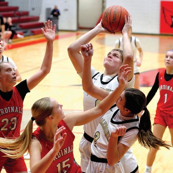 Caledonia’s Jessica Stendel battles inside against Lewiston-Altura’s Rinlee Bergan (#23) and Clara Kreidermacher (#15) in the Warriors 91-51 TRC win. The TRC-East leading Warriors (9-0, 12-3) have won five in a row. Photo by Craig Johnson
