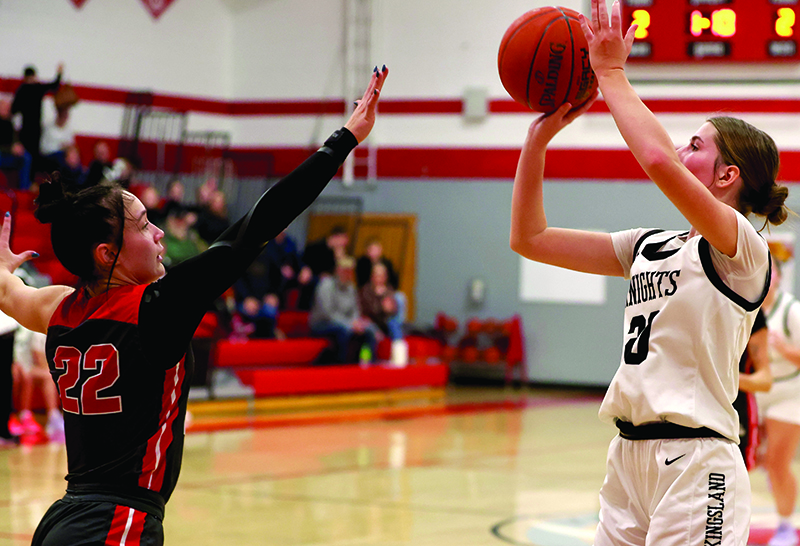 Houston’s Olivia Yohe tries to defend the shot of Kingsland’s Macy Runck in the Hurricane’s 54-33 SEC win, where Aubry Boldt scored 36 points.Photo by Craig Johnson