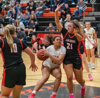 Chatfield’s Amaya Harmening encounters Lanesboro’s Hailey Erickson in the teams’ non-conference game. A late basket by Burro Cora Mayer, and Jensyn Storhoff’s near triple-double, propelled Lanesboro to a 60-58 win. Photo by Leif Erickson