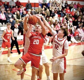 Grayson Stockdale (#12) plus (likely) Talan Lewison and Reid Hungerholt (both behind) all challenge the shot of Houston’s Hayden Ronnenberg in the Cardinals’ 67-52 SEC win. Photo by Craig Johnson