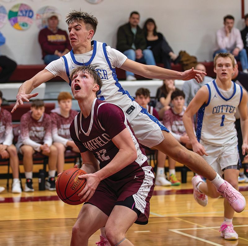 Chatfield’s Brooks Lea looks to elude Cotter/Hope Lutheran’s Lewis Shira in the teams’ notable TRC matchup. The Gophers beat the TRC-East leading Ramblers 67-57 and Albert Lea 77-57 to run their win streak to six. Photo by Leif Erickson