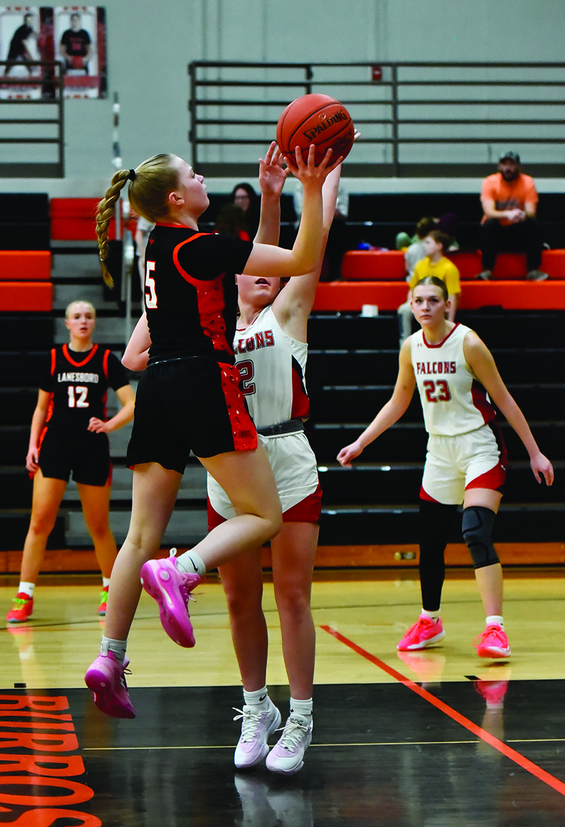 Emma Ruen takes the short running shot in the lane as a part of Lanesboro’s boys/girls series with Wabasha-Kellogg. Each Burro squad won, the girls 54-33, the boys 45-41. Photo by Ron Mayer