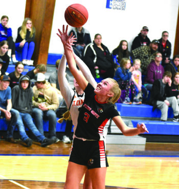 Layla Kittleson of Spring Grove/Mabel-Canton was fouled while bringing down this rebound during the Lions’ 69-32 win over St. Charles. SEC leading SG/M-C improved to 5-1 in league, 8-2 overall. Photo by Lee Epps