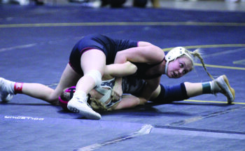 Chatfield’s Maizee Priebe looks for the turn and back-points or a pin in a match at the Bi-State tourney. Priebe went 5-2 for the meet to take fourth of 37 competitors. Photo by Paul Trende