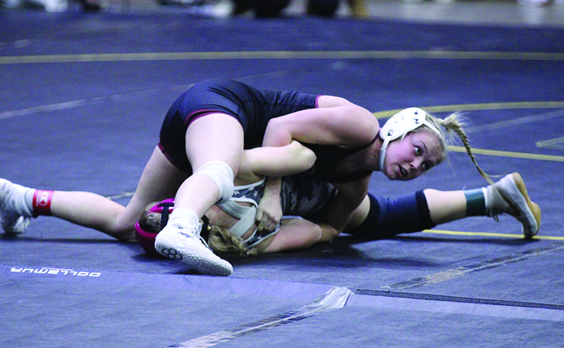 Chatfield’s Maizee Priebe looks for the turn and back-points or a pin in a match at the Bi-State tourney. Priebe went 5-2 for the meet to take fourth of 37 competitors. Photo by Paul Trende
