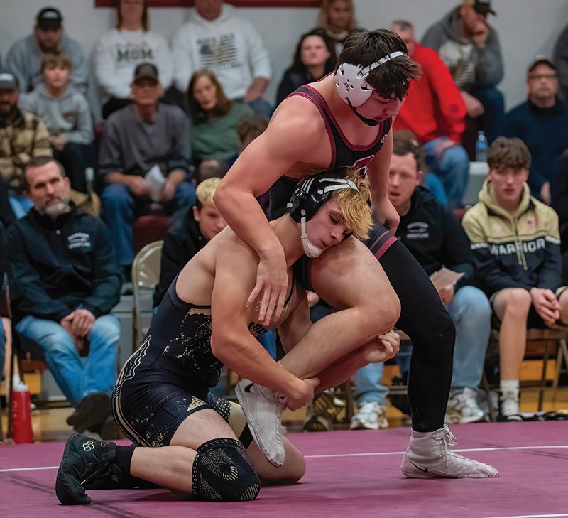 Caledonia/Houston’s Anthony Von Arx looks to take down Chatfield’s Andrew Boelter in a 189-pound match at the Gophers’ triangular. VonArx’s was one of only three Warrior wins in the dual, as Chatfield prevailed 49-17. Photo by Leif Erickson
