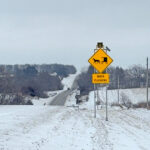 Watch for a new, flashing sign on Highway 44 near a guardrail between Mabel and Canton, to warn of slow moving buggies on this narrower part of the road. Photo by Tessia Wangsness