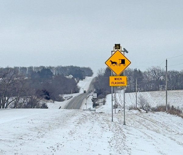 Watch for a new, flashing sign on Highway 44 near a guardrail between Mabel and Canton, to warn of slow moving buggies on this narrower part of the road. Photo by Tessia Wangsness