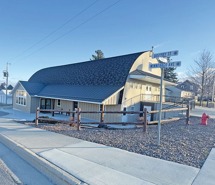 The Eitzen Community Center has a new roof, enclosed entrance on the lower level, accessible doors and a covered concrete patio. Photo by Charlene Corson Selbee