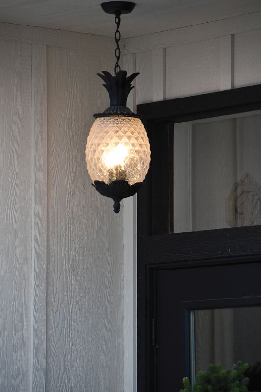 A pineapple light hangs above the front door of Frank & Julia’s in downtown Caledonia, symbolizing hospitality. Photo by Charlene Corson Selbee