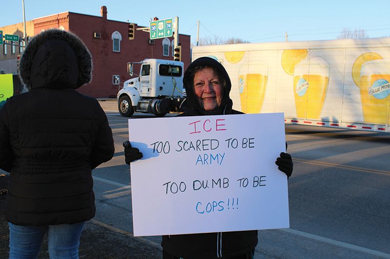 Linda O’Connor of rural Preston, was among 25 DFL-led protestors holding up signs in opposition of President Trump’s administrative policies. She joined a group of protestors in Chatfield, that has been exercising their Freedom of Speech, striving to make their voices heard. Photo by Jason Sethre