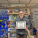Mike Steien, owner-operator along with his wife Sylvia, stands behind the counter at their NAPA store in Preston, Minn. They have another location 15 miles up the road in Chatfield, Minn. Photo by Jason Sethre