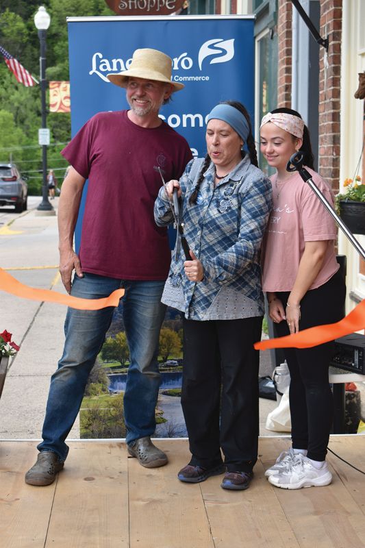 A ribbon cutting was held by the Lanesboro Area Chamber of Commerce for the Lanesboro Market on May 22, 2025. Shown cutting the ribbon are manager of Lanesboro Market Cynthia Ruen, center, along with her husband Peter and daughter Cyan. Photo by Barb Jeffers