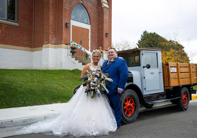 Jacklyn and Ryan at the church in front of their getaway vehicle, the 1926 REO Speedwagon. Photo submitted