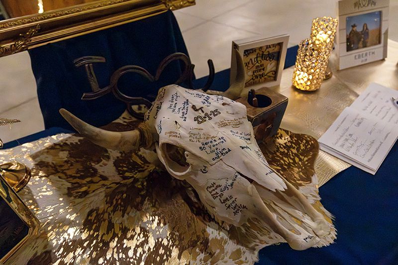 The bleached skull served as a guest book for the wedding guests. Photo by Bluestem Films LLC