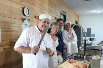 Jon and Mary Jo visited with Brett Stecher and Maria Rothen of the Pastry Shoppe as they prepare to serve the wedding guests. Photo by Salt and Pepper Photography