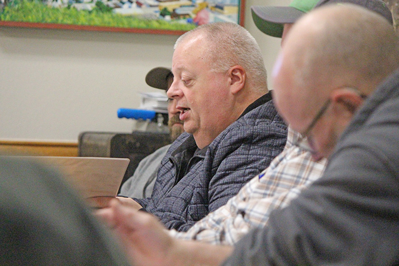 Village Councilor Travis Link (partially hidden), Mayor Dennis Overland, and Councilors Rick Ruberg (hidden) and Mike Ebner at the January 20 meeting. Photo by Kirsten Zoellner