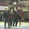 Chatfield’s Layne Root, Kaisen Johnson and Will Boelter grab the Section 1A wrestling title trophy after taking down Goodhue 33-31 in the finals. The Gophers three-peated as section champs and head back to state for a double encore. Photo by Paul Trende