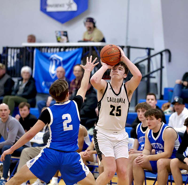 Caledonia’s Aaron Stemper focuses in on a three-point attempt in the Warriors 77-60 TRC win at Cotter/Hope Lutheran. Stemper nailed 8 of 9 threes, 12 of 13 shots, and scored 32 points in the win. Photo by Craig Johnson
