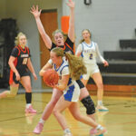 Lanesboro’s Cora Mayer defensively pressures a Hayfield/Schaeffer Academy player in the teams’ non-conference game. After five straight losses to teams with a 73-30 record, the Burros took down the Class A #8-ranked Vikings by 74-65 final. Photo by Ron Mayer