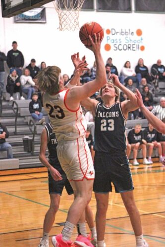 Fillmore Central’s Adrian Rindels gets ready to reject Lanesboro’s Levi Rogers’ in the teams’ non-conference rivalry game won by the Burros 51-44. Lanesboro (7-2, 12-3) in the SEC-East leader. Photo by Paul Trende