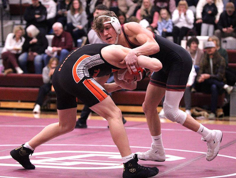 Chatfield’s Kaisen Johnson tangles early in his match with Farmington’s Austin Mitchell at the Gophers’ Saturday Quad. Johnson went 5-0 on the week, and Chatfield went 4-1, only losing to #1 in D-I Holmen by 29-23 tally. Photo by Paul Trende